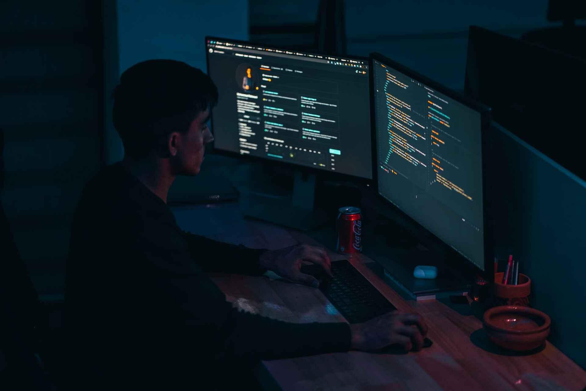 A man programming on his computer