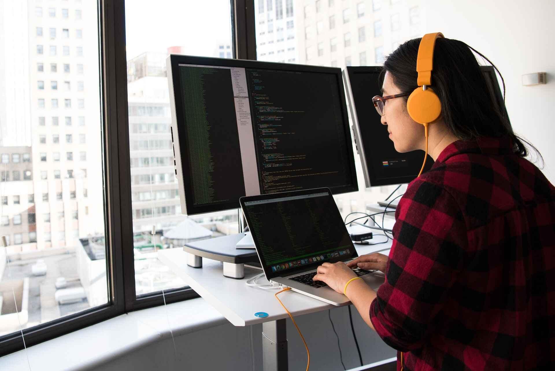 A programmer coding in his laptop